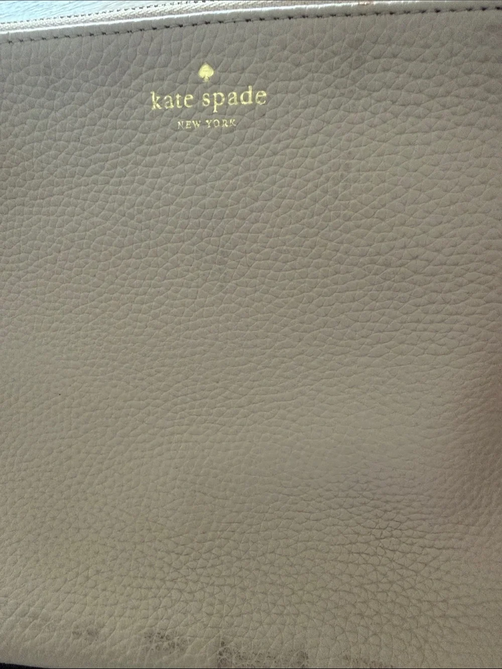 kate spade blush pink pebbled leather clutch with black tassel trim